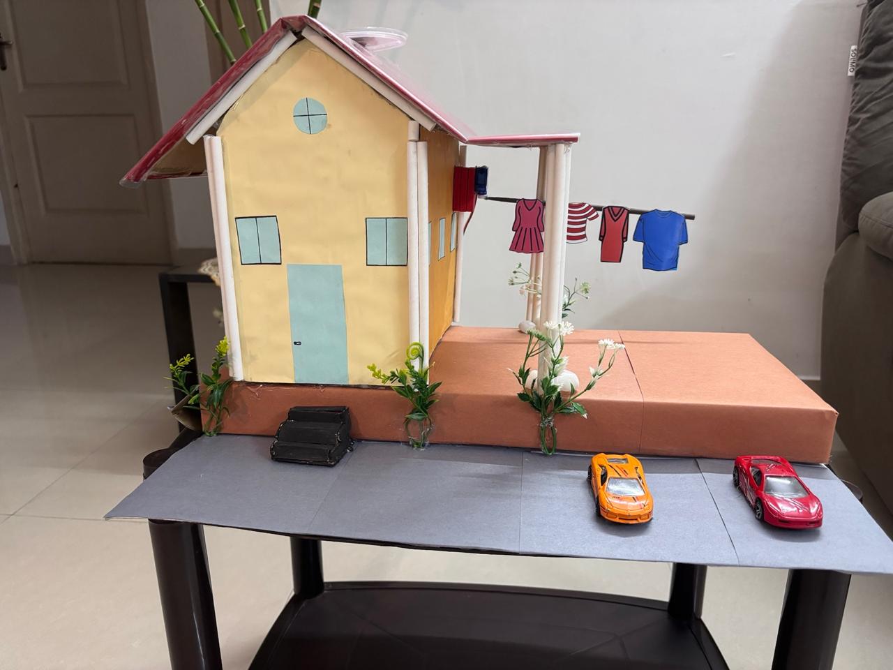 Smart clothes drying rod model with rain sensor and servo-controlled rod that retracts into the roof
